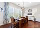 Charming dining room with ample natural light, a stylish chandelier, and a large wooden table at 130 Monteray Oaks Cir, Fort Mill, SC 29715