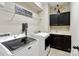 A functional laundry room featuring modern washer, dryer and storage cabinets at 130 Monteray Oaks Cir, Fort Mill, SC 29715