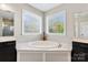 Beautiful main bathroom featuring dual vanities, garden tub, and separate walk-in shower at 130 Monteray Oaks Cir, Fort Mill, SC 29715