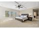 Relaxing main bedroom with large windows and decorative trey ceiling at 130 Monteray Oaks Cir, Fort Mill, SC 29715