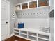 Organized mudroom features a bench with storage, coat hooks, and overhead cubbies for baskets at 130 Monteray Oaks Cir, Fort Mill, SC 29715