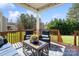 Inviting outdoor porch with comfortable seating and a serene backyard view at 130 Monteray Oaks Cir, Fort Mill, SC 29715