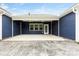Covered back patio features a concrete floor, backyard access and is perfect for outdoor entertaining at 1300 Dali Blvd, Mount Holly, NC 28120