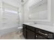 Bathroom featuring a tub and shower combination at 1300 Dali Blvd, Mount Holly, NC 28120