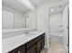 Modern bathroom features a large vanity, white countertops, stylish fixtures, and a tub and shower combo at 1300 Dali Blvd, Mount Holly, NC 28120