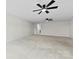 Spacious bedroom features neutral carpet, white walls, multiple ceiling fans, and plenty of natural light at 1300 Dali Blvd, Mount Holly, NC 28120