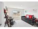 Well-lit bedroom with a daybed, desk, and ladder bookshelf with an exterior view at 1300 Dali Blvd, Mount Holly, NC 28120