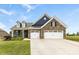 Charming brick home with a three-car garage, black shutters and a beautifully maintained lawn at 1300 Dali Blvd, Mount Holly, NC 28120