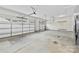 Spacious garage with concrete floors and two car garage doors providing ample parking and storage space at 1300 Dali Blvd, Mount Holly, NC 28120