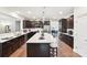 Open kitchen featuring a large island with seating and stainless steel appliances at 1300 Dali Blvd, Mount Holly, NC 28120