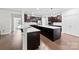 Stylish kitchen with a large island, white countertops and dark wood cabinetry at 1300 Dali Blvd, Mount Holly, NC 28120