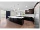 Beautiful kitchen featuring a large island, dark wood cabinets and stainless appliances at 1300 Dali Blvd, Mount Holly, NC 28120