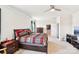 Bright bedroom featuring a ceiling fan, window with curtains, and a closet for storage at 1300 Dali Blvd, Mount Holly, NC 28120