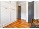 Bright bedroom with hardwood floors, fresh white walls and built-in storage at 1418 Seigle Ave, Charlotte, NC 28205