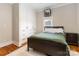 Well-lit bedroom with built-in wardrobe, wood floors, and modern decor at 1418 Seigle Ave, Charlotte, NC 28205