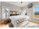 Bright bedroom with hardwood floors, ample natural light, and a custom bed frame at 1418 Seigle Ave, Charlotte, NC 28205