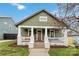 Charming two-story home with a well-manicured lawn and inviting front porch at 1418 Seigle Ave, Charlotte, NC 28205