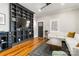 Stylish living room featuring a custom entertainment center and hardwood floors at 1418 Seigle Ave, Charlotte, NC 28205