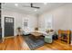 Bright living room with hardwood floors, a white sectional sofa, and stylish decor at 1418 Seigle Ave, Charlotte, NC 28205