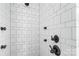 Tiled shower featuring black hardware, multiple shower heads, and neutral grout at 1418 Seigle Ave, Charlotte, NC 28205