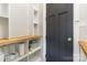 Custom storage with open shelving and door for home organization at 1418 Seigle Ave, Charlotte, NC 28205