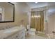 A traditional bathroom with a granite vanity, toilet, and combination shower and tub at 15100 Durmast Ct, Mint Hill, NC 28227