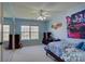 Spacious bedroom featuring neutral blue, comfortable carpet, and natural lighting at 15100 Durmast Ct, Mint Hill, NC 28227