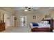 Spacious bedroom with tray ceilings, adjoining bath, carpeted flooring, and neutral paint at 15100 Durmast Ct, Mint Hill, NC 28227