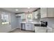 Kitchen showcasing white cabinets, modern appliances, updated countertops, and neutral flooring at 155 31St Sw St, Hickory, NC 28602