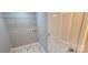 A neutral colored laundry room with white door and a modern-looking marble-patterned floor at 155 31St Sw St, Hickory, NC 28602