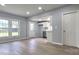 Spacious living area with wood-look flooring and neutral paint, leading to an open kitchen at 155 31St Sw St, Hickory, NC 28602