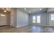 An open-concept living area features recessed lighting, light gray walls, and modern flooring throughout at 155 31St Sw St, Hickory, NC 28602