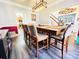 The dining room offers an open view, featuring a sizable table and stylish chairs adjacent to a kitchen and staircase at 1743 Park Grove Nw Pl, Concord, NC 28027