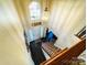 Grand foyer with high ceilings, a statement light fixture, and a view of the staircase and entrance at 1743 Park Grove Nw Pl, Concord, NC 28027