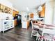 Bright kitchen featuring wooden cabinets, a kitchen island and dining area at 1743 Park Grove Nw Pl, Concord, NC 28027