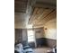 Dimly lit living room with a half painted wall and a wooden boarded up section of the ceiling at 185 Flat Stone Dr, Clover, SC 29710