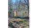 Exterior view of two sheds in need of repair in a wooded backyard at 185 Flat Stone Dr, Clover, SC 29710