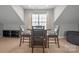 Attic dining area with table, four chairs, and natural lighting at 18948 Kanawha Dr, Cornelius, NC 28031