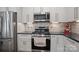 Close-up of the kitchen features stainless steel appliances and white subway tile backsplash at 18948 Kanawha Dr, Cornelius, NC 28031