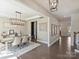 Elegant dining room with modern chandelier and a long table with seating for six at 2025 Sweet Magnolia Ln, Clover, SC 29710