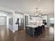 Spacious kitchen featuring white cabinets, stainless steel appliances, and a large island at 2025 Sweet Magnolia Ln, Clover, SC 29710