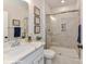 Stylish bathroom with marble-tiled shower, glass doors, modern vanity, and decorative wall art at 208 Wesser St # 8, Davidson, NC 28036