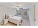 Cozy bedroom featuring neutral tones and natural light from two windows at 220 Kenway Loop # 41, Mooresville, NC 28117