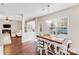 The kitchen nook features a wooden table with barstool seating and is adjacent to the kitchen and living area at 220 Kenway Loop # 41, Mooresville, NC 28117