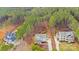 Expansive aerial view showcasing the property, neighboring homes, and surrounding lush forest at 220 Kenway Loop, Mooresville, NC 28117