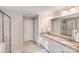 Bathroom featuring double sink vanity, glass enclosed shower and storage at 220 Kenway Loop, Mooresville, NC 28117