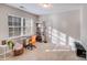 Bright bedroom with natural light, a sewing table, and a comfortable workspace at 220 Kenway Loop, Mooresville, NC 28117