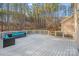 Spacious deck with outdoor seating, perfect for relaxing and enjoying the wooded backyard at 220 Kenway Loop, Mooresville, NC 28117