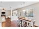 Cozy dining area with barstool seating and natural light from large window overlooking deck at 220 Kenway Loop, Mooresville, NC 28117