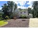 Charming two-story home with a covered front porch and a well-manicured lawn at 220 Kenway Loop, Mooresville, NC 28117